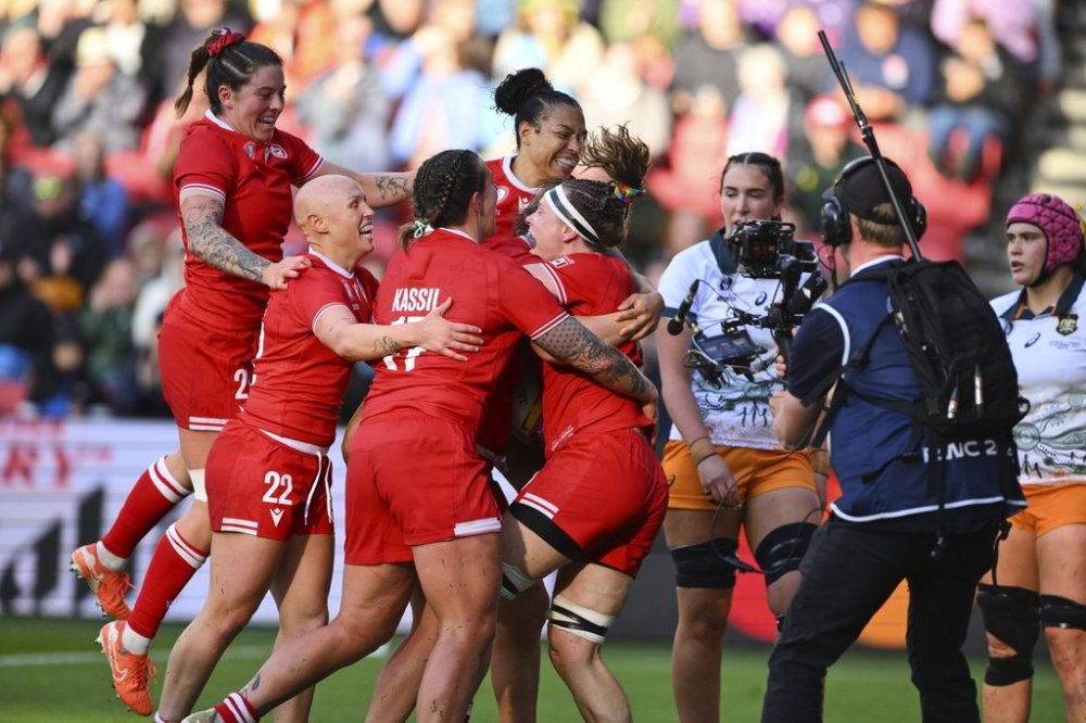 Canada's players celebrates a try during the Women's Rugby World Cup 2025 quarterfinal match between Canada and Australia, in Bristol, England, Saturday, Sept. 13, 2025. (AP Photo/Anthony Upton)