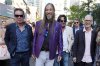 The Tragically Hip band members, from left, Gord Sinclair, Rob Baker, Paul Langlois (light jacket) and Johnny Fay, far right, walk from the premiere of a documentary film about them, 
