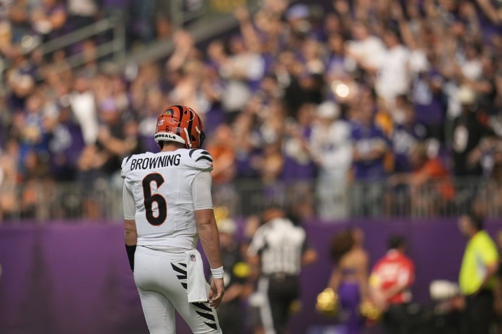 Cincinnati Bengals quarterback Jake Browning walks off after throwing an interception during the first half of an NFL football game against the Minnesota Vikings, Sunday, Sept. 21, 2025, in Minneapolis. (AP Photo/Mike Stewart)