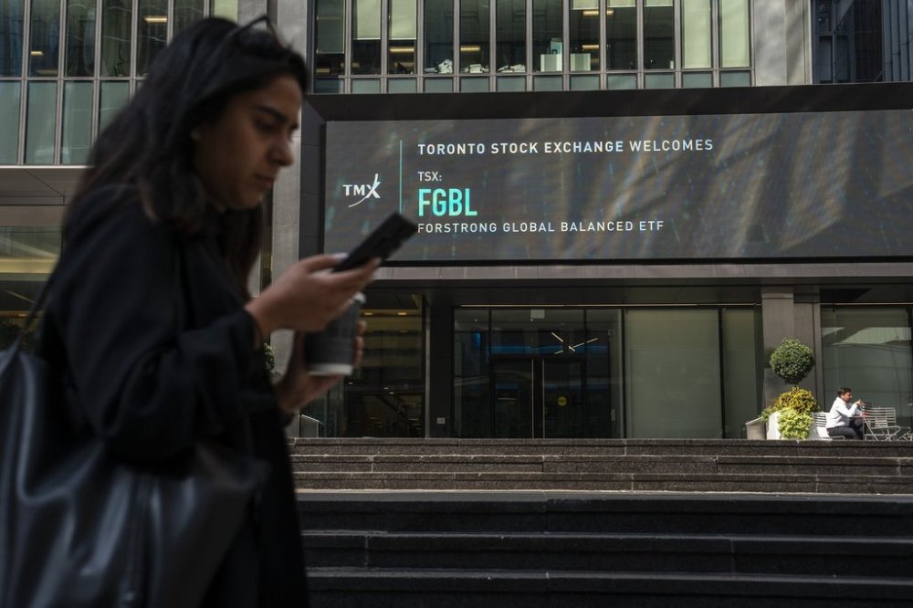 Rebalancing means regularly realigning the portfolio with the ideal mix of investments in equities, bonds and fixed income, among other assets. A person walks past the TMX Market Centre in Toronto, Wednesday, Sept. 11, 2024. THE CANADIAN PRESS/Paige Taylor White
