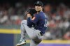 Seattle Mariners pitcher Bryan Woo (22) pitches during the first inning of a baseball game against the Houston Astros, Friday, Sept. 19, 2025, in Houston. (AP Photo/Kevin M. Cox)