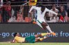 Nigeria's Tolu Arokodare jumps over a challenge by South Africa's Siyabonga Ngezana during a World Cup Group C qualifying soccer match between South Africa and Nigeria at the Free State stadium in Bloemfontein, South Africa, Tuesday, Sept. 9, 2025. (AP Photo/Themba Hadebe)