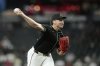 Arizona Diamondbacks starting pitcher Brandon Pfaadt throws against the San Francisco Giants during the first inning of a baseball game Wednesday, Sept. 17, 2025, in Phoenix. (AP Photo/Ross D. Franklin)