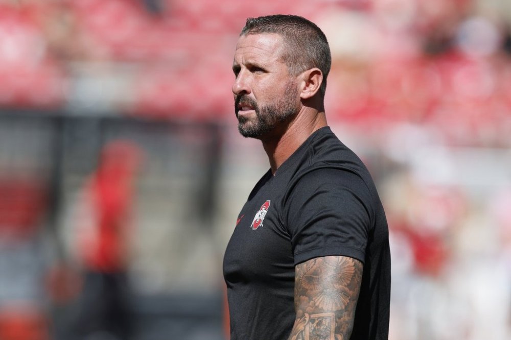 FILE - Ohio State offensive coordinator and wide receivers coach Brian Hartline stands on the field before the start of their NCAA college football game against Texas, Saturday, Aug. 30, 2025, in Columbus, Ohio. (AP Photo/Jay LaPrete, File)