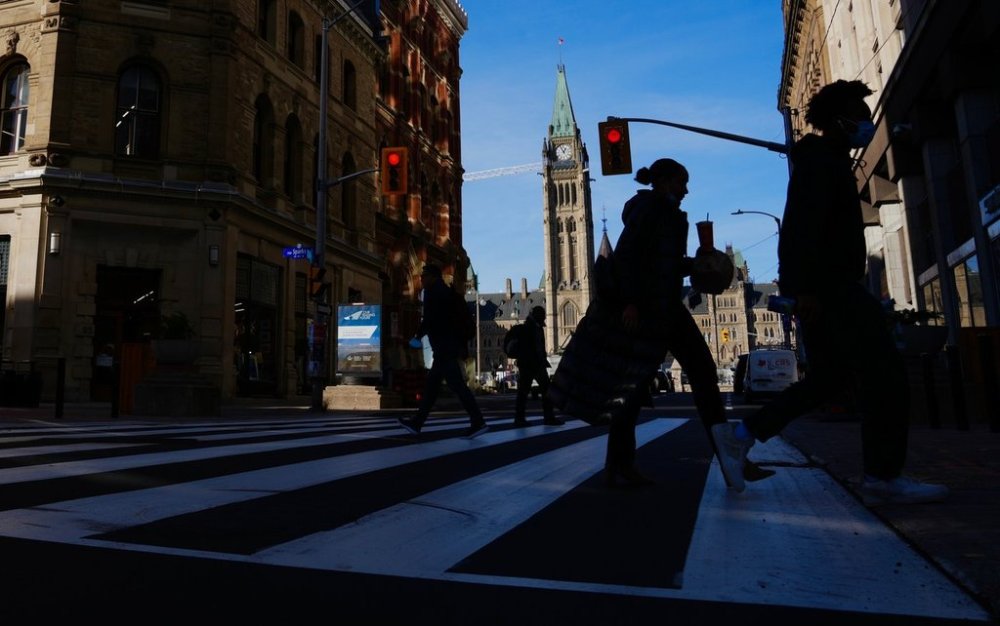 Pedestrians make their way along Sparks Street Mall in Ottawa on Tuesday, Nov. 9, 2021. THE CANADIAN PRESS/Sean Kilpatrick