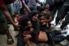 FILE.- Faten Mreish holds her son's body at a hospital morgue in Deir al-Balah, Gaza Strip, Aug. 28, 2024, after he and others were killed in an Israeli bombardment. (AP Photo/Abdel Kareem Hana,File)