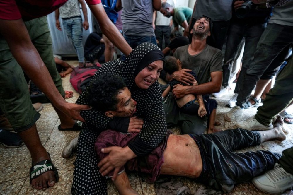 FILE.- Faten Mreish holds her son's body at a hospital morgue in Deir al-Balah, Gaza Strip, Aug. 28, 2024, after he and others were killed in an Israeli bombardment. (AP Photo/Abdel Kareem Hana,File)