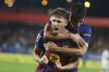 Barcelona's Fermin Lopez celebrates scoring his side's 3rd goal with teammate Gerard Martin during a Spanish La Liga soccer match between FC Barcelona and Valencia at the Johan Cruyff stadium in Barcelona, Spain, Sunday, Sept. 14, 2025. (AP Photo/Joan Monfort)