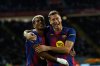 Barcelona's Robert Lewandowski, right, celebrates with Lamine Yamal scoring his side's 2nd goal during a Spanish La Liga soccer match between FC Barcelona and Real Sociedad at the Lluis Companys Olympic Stadium in Barcelona, Spain, Sunday, Sept. 28, 2025. (AP Photo/Joan Monfort)