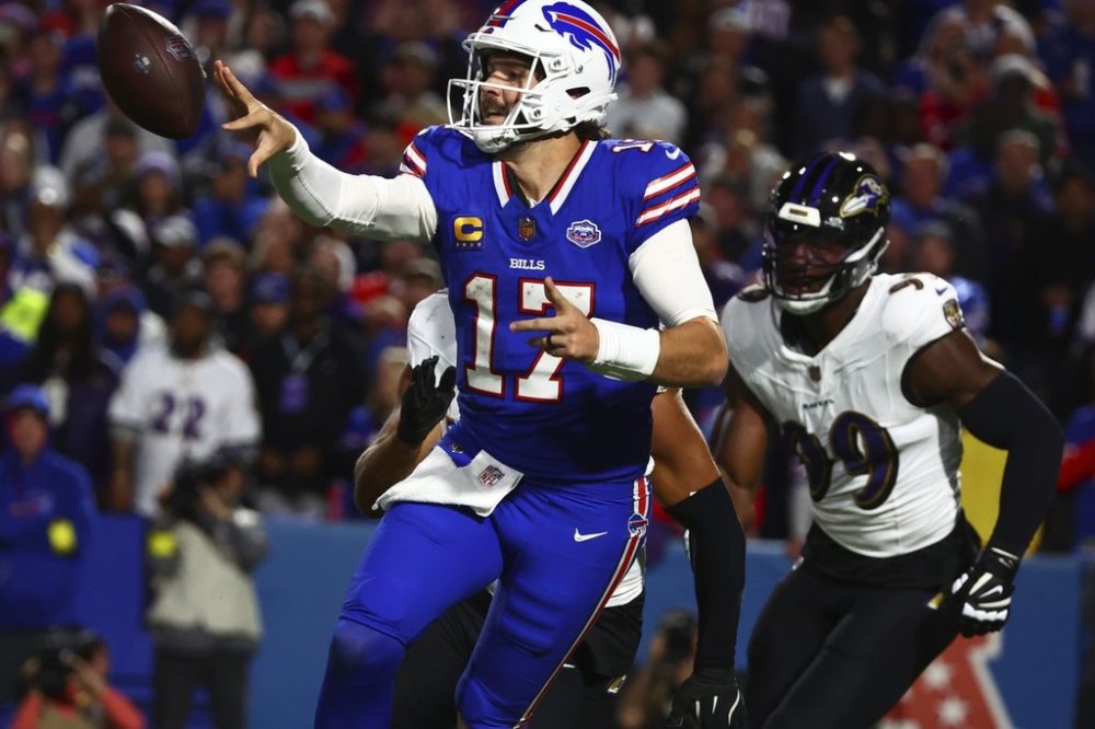 Buffalo Bills quarterback Josh Allen (17) passes under pressure against the Baltimore Ravens during the second half of an NFL football game in Orchard Park, N.Y., Sunday, Sept. 7, 2025. (AP Photo/Jeffrey T. Barnes)