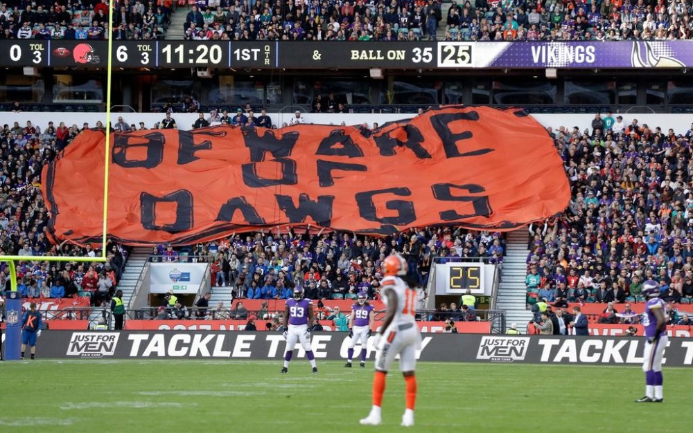 FILE - Cleveland Browns supporters unfurl a giant banner during the first half of an NFL football game against Minnesota Vikings at Twickenham Stadium in London, Oct. 29, 2017. (AP Photo/Matt Dunham, File)