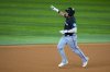 Miami Marlins' Javier Sanoja gestures after hitting a pinch hit solo home run off Texas Rangers relief pitcher Robert Garcia during the seventh inning of a baseball game Friday, Sept. 19, 2025, in Arlington, Texas. (AP Photo/Julio Cortez)