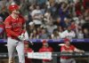Los Angeles Angels designated hitter Mike Trout watches his hit clear the wall for a home run in the eighth inning against the Colorado Rockies on Saturday, Sept. 20, 2025, in Denver. (AP Photo/RJ Sangosti)