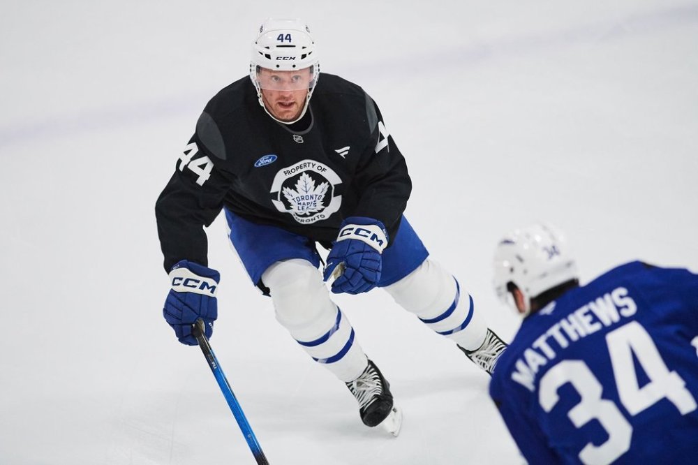 Maple Leafs defenceman Morgan Rielly (44) takes part in a drill with teammate Auston Matthews (34) at training camp in Toronto on Thursday, Sept. 18, 2025. THE CANADIAN PRESS/Sammy Kogan