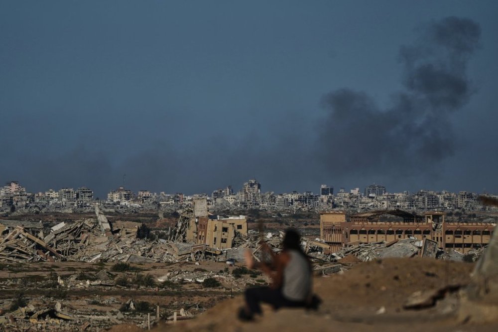 Smoke rises following an Israeli military strike in Gaza City, as seen from the central Gaza Strip, Tuesday, Oct. 7, 2025. (AP Photo/Abdel Kareem Hana)