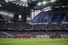 Players stand during a minute of silence for a former boxer Ricky Hatton before the Premier League soccer match between Manchester City and Manchester United in Manchester, England, Sunday, Sept. 14, 2025. (AP Photo/Dave Thompson)