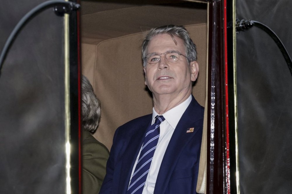 US Treasury Secretary Scott Bessent rides in a carriage during a procession through Windsor Castle on the occasion of President Donald Trump's visit, in Windsor, England, Wednesday, Sept. 17, 2025. (Toby Melville/Pool Photo via AP)
