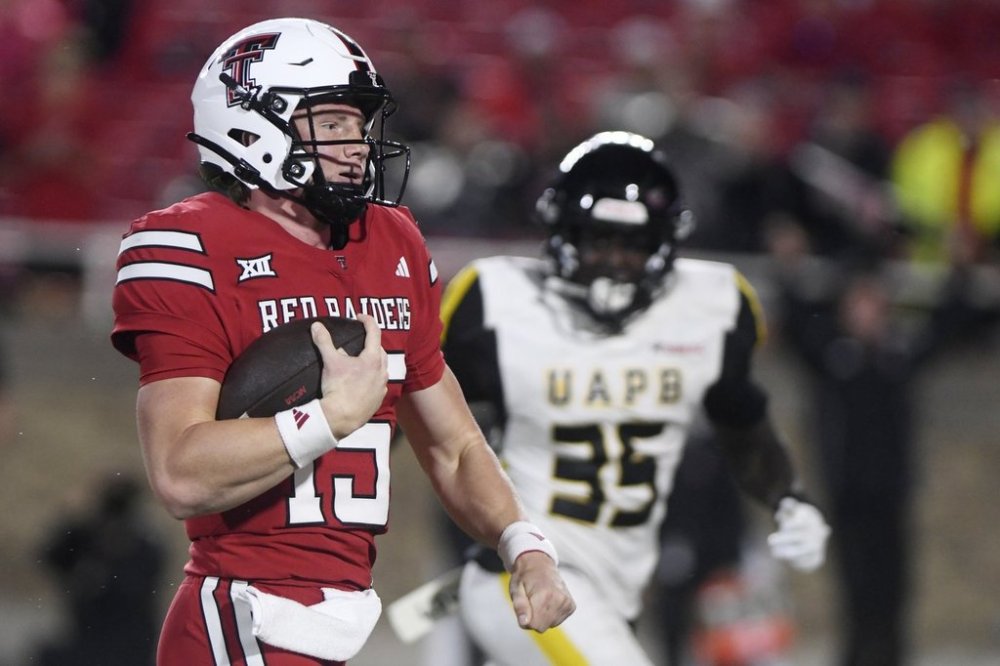 Texas Tech quarterback Will Hammond (15) runs for a touchdown during the second half of an NCAA college football game against Arkansas-Pine Bluff, Saturday, Aug. 30, 2025, in Lubbock, Texas. (AP Photo/Annie Rice)