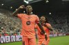Barcelona's Marcus Rashford, left, celebrates after scoring his side second goal with Jules Kounde during the Champions League, opening phase soccer match between Newcastle and Barcelona in Newcastle, England, Thursday, Sept. 18, 2025. (AP Photo/Jon Super)