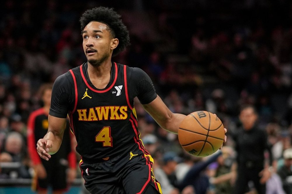 FILE - Atlanta Hawks guard Kobe Bufkin (4) drives during the second half of an NBA basketball game against the Charlotte Hornets, Saturday, Nov. 30, 2024, in Charlotte, N.C. (AP Photo/Matt Kelley, File)