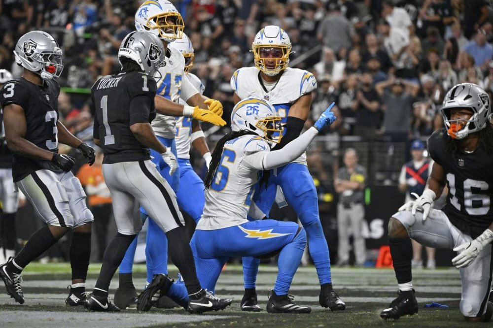 Los Angeles Chargers cornerback Donte Jackson (26) celebrates after making an interception against the Las Vegas Raiders during the second half of an NFL football game, Monday, Sept. 15, 2025, in Las Vegas. (AP Photo/David Becker)