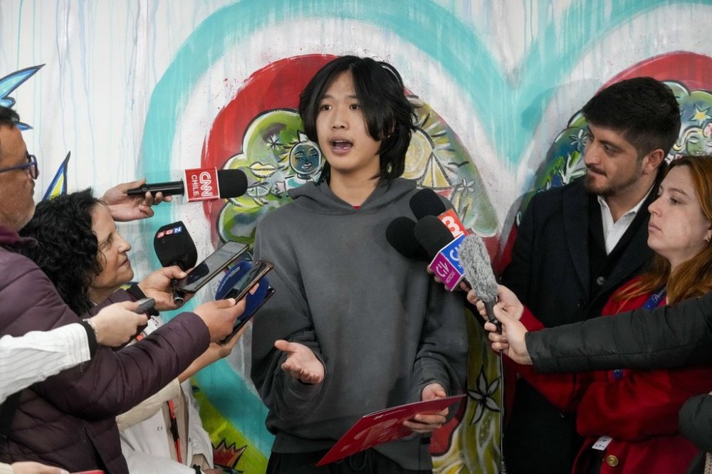 U.S. influencer Ethan Guo speaks with journalists at an event about his donation to children's cancer rehabilitation programs, at the