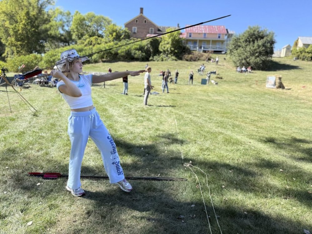 12-year-old Ava Nolf of Clinton, Connecticut practices throwing an atlatl during the Northeastern Atlatl Championship in Addison, Vt. on Saturday, September 20, 2025. (AP Photo/Amanda Swinhart)