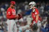 Cincinnati Reds pitcher Hunter Greene gets a visit to the mound from catcher Tyler Stephenson after Greene gave up a solo home run to Los Angeles Dodgers' Tommy Edman during the third inning in Game 1 of the National League Wild Card baseball playoff series Tuesday, Sept. 30, 2025, in Los Angeles. (AP Photo/Mark J. Terrill)