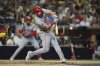Cincinnati Reds' Tyler Stephenson hits a two-run home run during the ninth inning of a baseball game against the San Diego Padres Tuesday, Sept. 9, 2025, in San Diego. (AP Photo/Gregory Bull)
