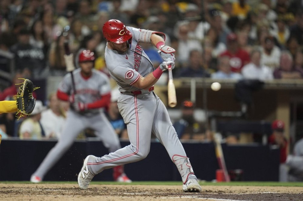 Cincinnati Reds' Tyler Stephenson hits a two-run home run during the ninth inning of a baseball game against the San Diego Padres Tuesday, Sept. 9, 2025, in San Diego. (AP Photo/Gregory Bull)