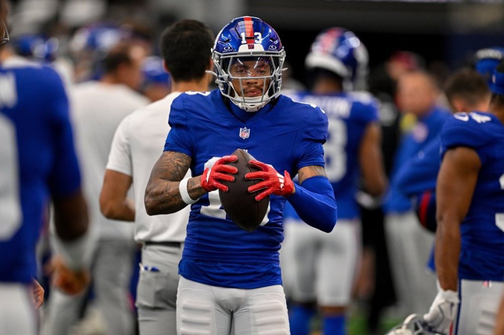 FILE - New York Giants wide receiver Jalin Hyatt (13) warms up on the sidelines during an NFL football game against the Dallas Cowboys Sept. 14, 2025, in Arlington, Texas. (AP Photo/Jerome Miron, File)