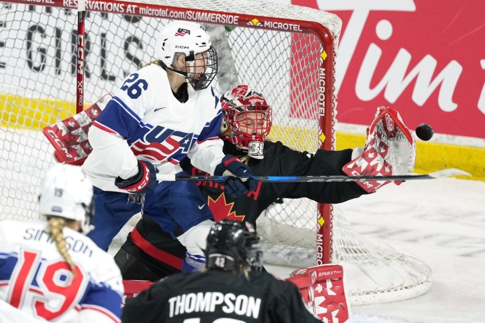 Team Canada goaltender Emerance Maschmeyer, right, makes a save in front of Team USA's Kendall Coyne Schofield during the second period of Rivalry Series hockey action in Summerside, P.E.I. on Saturday, Feb. 8, 2025. THE CANADIAN PRESS/Darren Calabrese