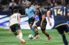 Vancouver Whitecaps' Brian White, back centre, moves the ball while being watched by Portland Timbers' David Ayala during the second half of an MLS soccer match, in Vancouver, on Wednesday, September 24, 2025. THE CANADIAN PRESS/Darryl Dyck