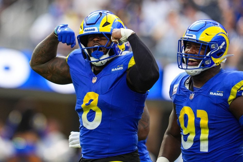 CORRECTS TO RAMS LINEBACKER JARED VERSE (8) NOT COLTS PUNTER RIGOBERTO SANCHEZ - Los Angeles Rams linebacker Jared Verse (8) celebrates with defensive end Kobie Turner (91) after a defensive pressure against the Indianapolis Colts during the second hall of an NFL football game Sunday, Sept. 28, 2025, in Inglewood, Calif. (AP Photo/Marcio Jose Sanchez)