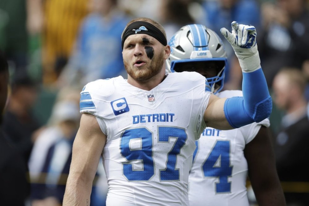 Detroit Lions defensive end Aidan Hutchinson (97) warms up before an NFL football game against the Green Bay Packers Sunday, Sept. 7, 2025, in Green Bay, Wis. (AP Photo/Matt Ludtke)