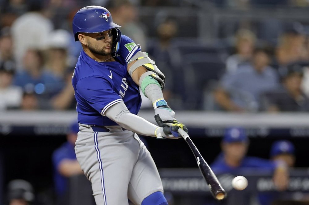 Toronto Blue Jays' Bo Bichette hits a run scoring double during the first inning of a baseball game against the New York Yankees, Friday, Sept. 5, 2025, in New York. (AP Photo/Adam Hunger)