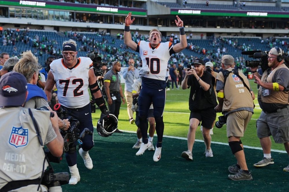 Denver Broncos quarterback Bo Nix (10) celebrates as he leaves the field after an NFL football game against the Philadelphia Eagles on Sunday, Oct. 5, 2025, in Philadelphia. (AP Photo/Matt Rourke)