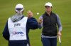 Leah John, of Canada, tosses a ball to her caddie during the first round of the U.S. Women's Open golf tournament at Erin Hills Thursday, May 29, 2025, in Erin, Wis. (AP Photo/Matt York)