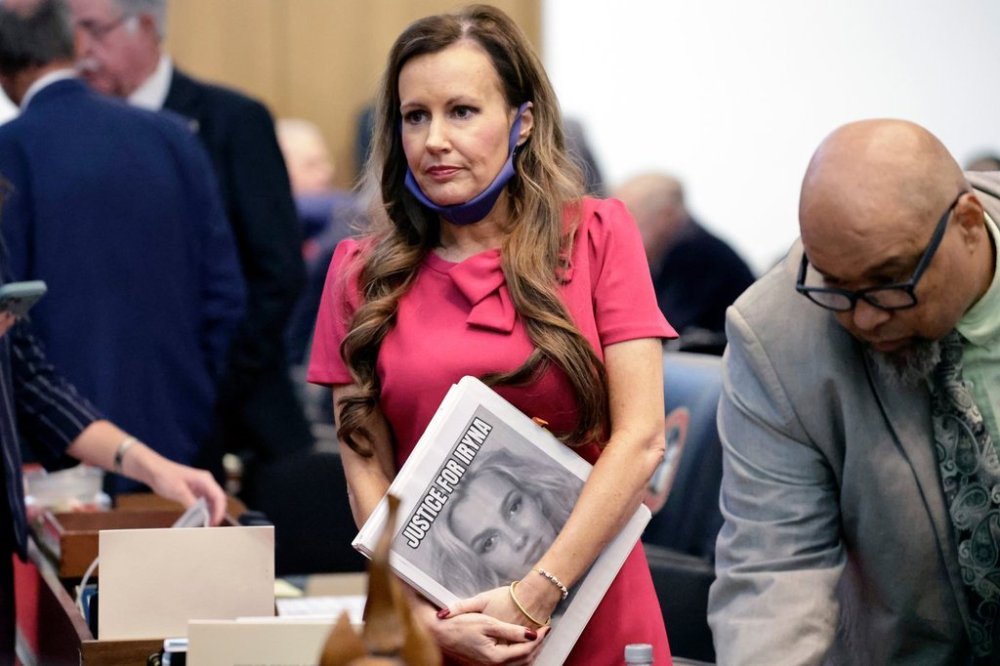 Rep. Tricia Cotham, R-Mecklenburg, center, holds a