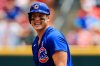 FILE - Chicago Cubs' Anthony Rizzo laughs at second base during a baseball game against the Cincinnati Reds in Cincinnati, Sunday, July 4, 2021. The Reds won 3-2. (AP Photo/Aaron Doster, File)