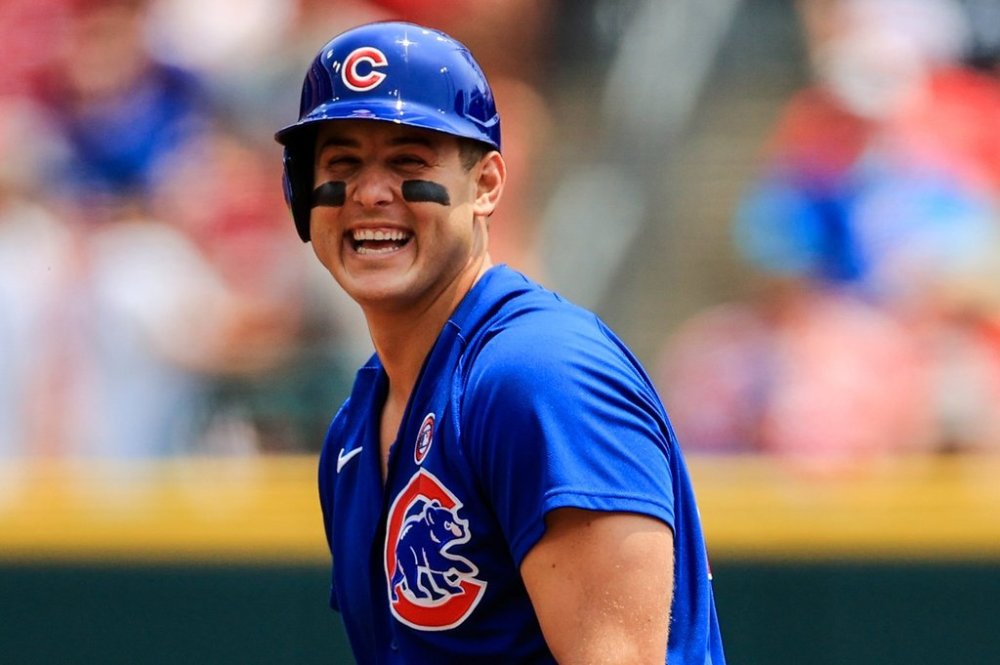 FILE - Chicago Cubs' Anthony Rizzo laughs at second base during a baseball game against the Cincinnati Reds in Cincinnati, Sunday, July 4, 2021. The Reds won 3-2. (AP Photo/Aaron Doster, File)
