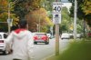 Vehicles pass a sign advising drivers of an upcoming speed camera in Toronto, on Wednesday, Sept. 24, 2025. THE CANADIAN PRESS/Sammy Kogan