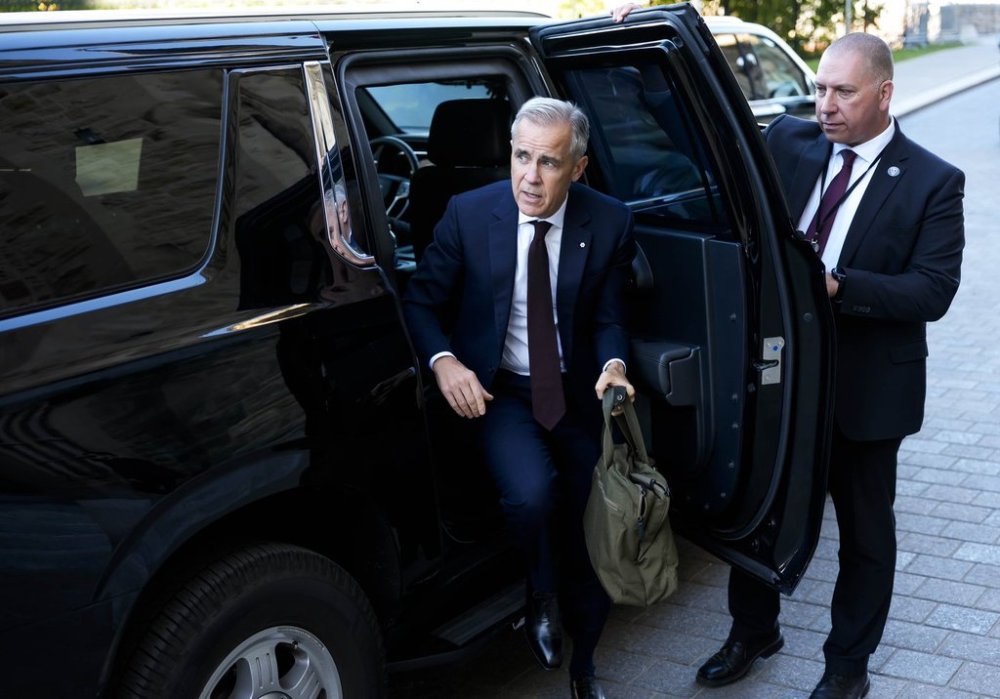 Prime Minister Mark Carney arrives on Parliament Hill in Ottawa before a meeting of the Liberal caucus, on Wednesday, Oct. 1, 2025. THE CANADIAN PRESS/Justin Tang