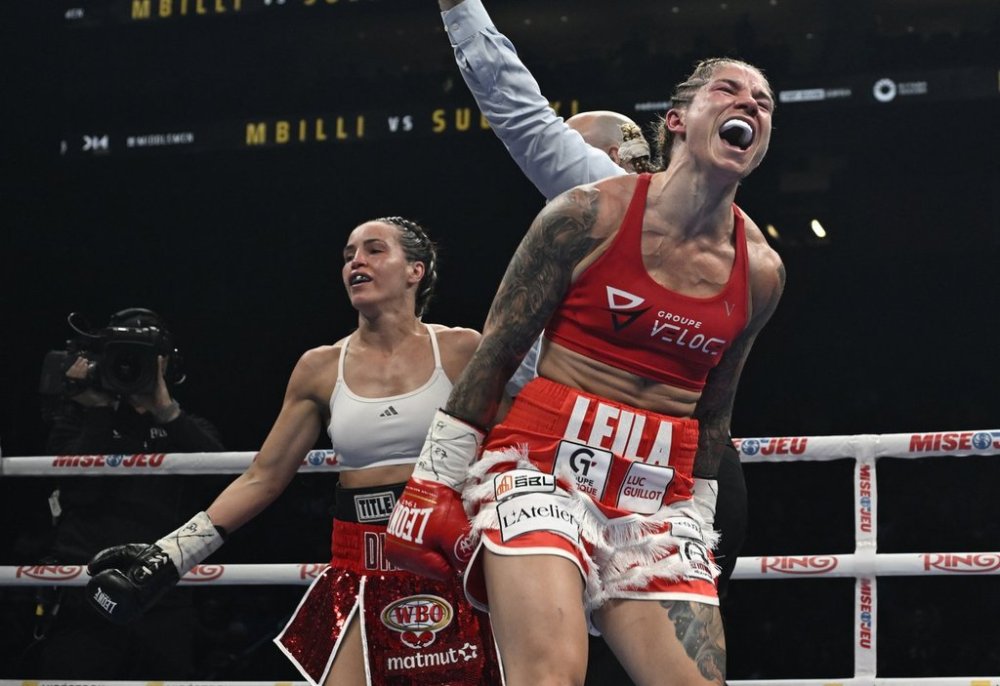 Leila Beaudoin, right, reacts to her victory over Elhem Mekhaled in a WBO super featherweight championship fight in Quebec City on Friday, June 27, 2025. THE CANADIAN PRESS/Jacques Boissinot