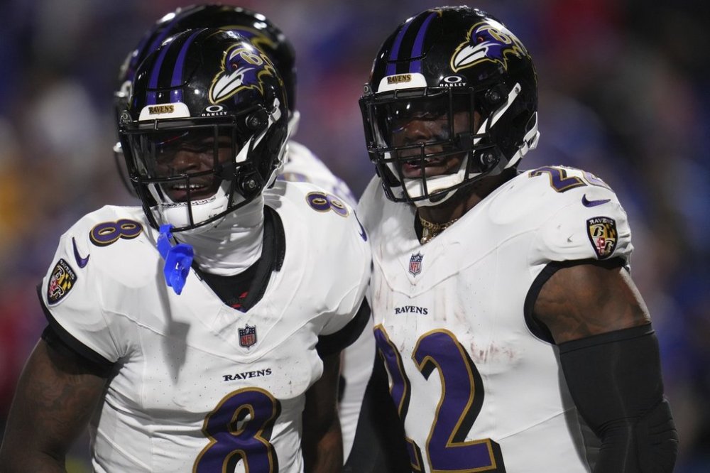 Baltimore Ravens running back Derrick Henry (22) celebrates his touchdown run with teammate Lamar Jackson (8) during the second half of an NFL football game against the Buffalo Bills in Orchard Park, N.Y., Sunday, Sept. 7, 2025. (AP Photo/Gene J. Puskar)