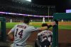Houston Astros' Mauricio Dubon (14) and Jose Altuve (27) watch from the dugout during the third inning of a baseball game against the Los Angeles Angels Saturday, Sept. 27, 2025, in Anaheim, Calif. (AP Photo/Jae C. Hong)
