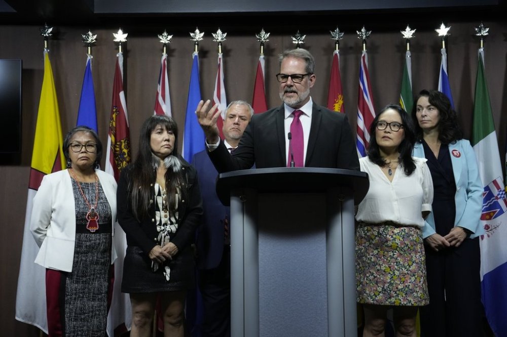 NDP MP and labour critic Alexandre Boulerice is flanked by members of the NDP caucus during a news conference on Parliament Hill in Ottawa, Tuesday, Sept. 16, 2025. From left to right, MP for Nunavut Lori Idlout, MP for Winnipeg Centre Leah Gazan, MP for Courtenay-Alberni Gord Johns, MP for Rosemont-La Petite-Patrie Alexandre Boulerice, MP for Vancouver East Jenny Kwan, MP for Edmonton Strathcona Heather McPherson. THE CANADIAN PRESS/Adrian Wyld