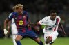 PSG's Nuno Mendes fouls Barcelona's Lamine Yamal during the Champions League opening phase soccer match between Barcelona and Paris Saint-Germain at the Lluis Companys Olympic Stadium in Barcelona, Spain, Wednesday, Oct.1, 2025. (AP Photo/Emilio Morenatti)