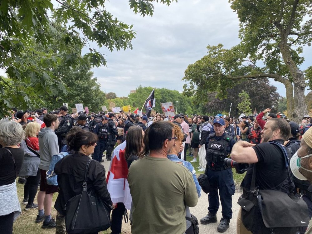 Police and Fire officers separate an anti-immigration protest from a counter-protest in Christie Pits Park, in Toronto, Saturday, Sept. 13, 2025. THE CANADIAN PRESS/Vanessa Tiberio