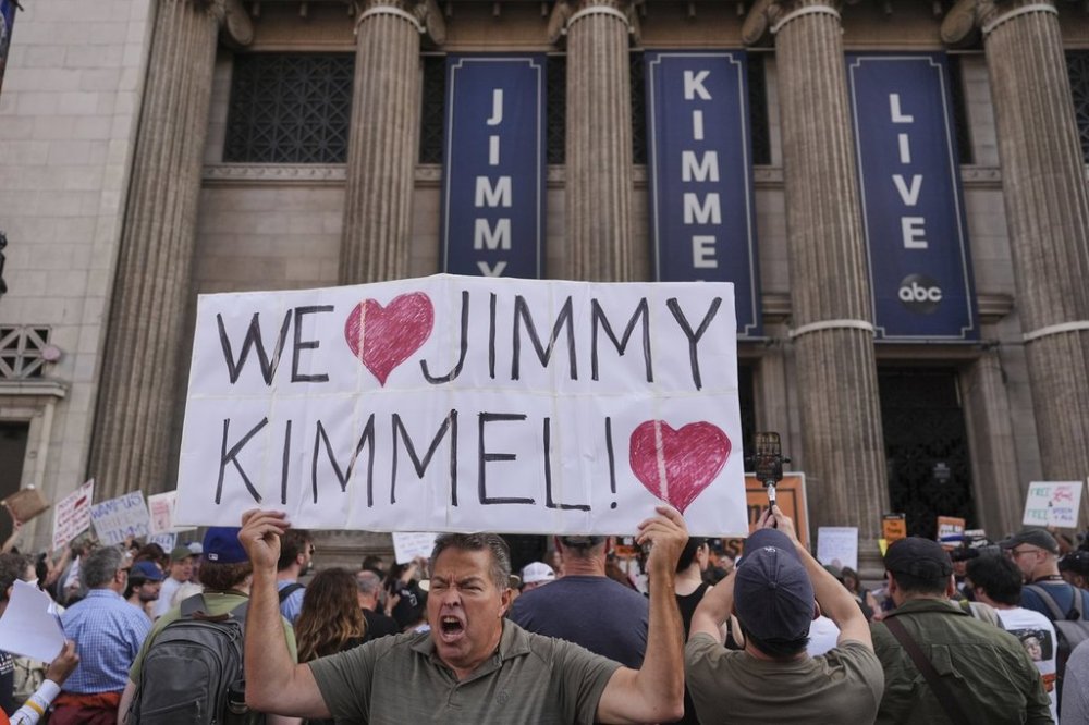 Oscar Villanueva holds a sign outside El Capitan Entertainment Centre, where the late-night show